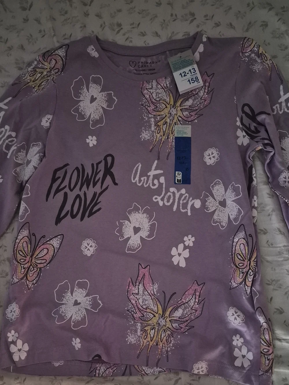 NWT- Primark Care Long Sleeve Top. Lilac Butterfly and Floral Graphic Tee